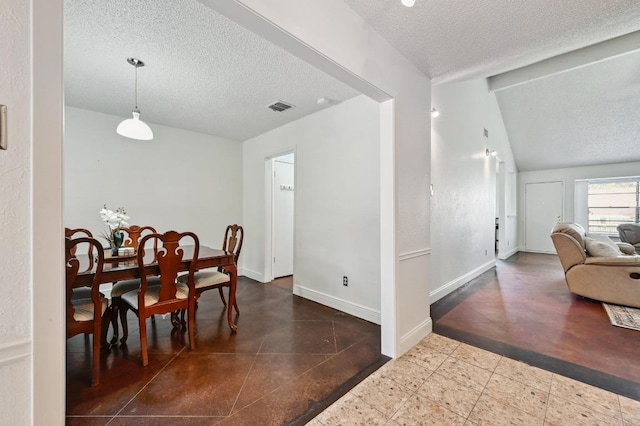 dining space featuring visible vents, baseboards, a textured ceiling, and lofted ceiling