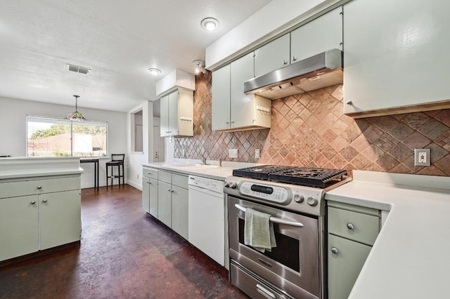 kitchen featuring light countertops, visible vents, white dishwasher, under cabinet range hood, and stainless steel gas range oven