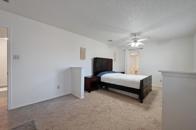 carpeted bedroom with a ceiling fan, baseboards, visible vents, and a textured ceiling