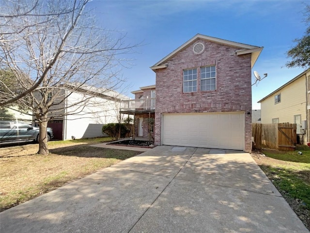 traditional-style house featuring a garage, concrete driveway, brick siding, and fence