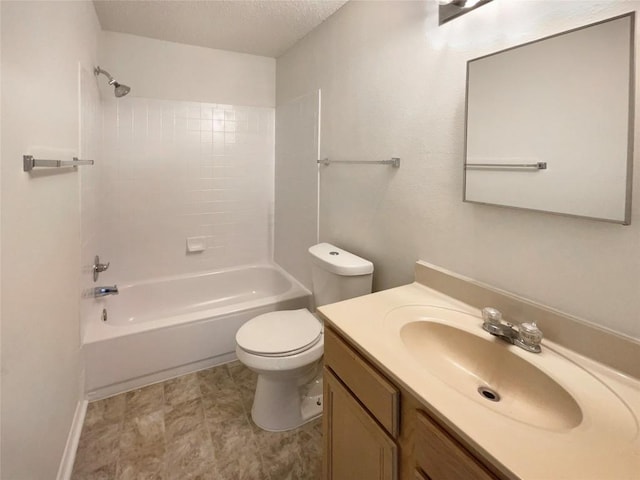 full bathroom featuring toilet, shower / washtub combination, a textured ceiling, and vanity