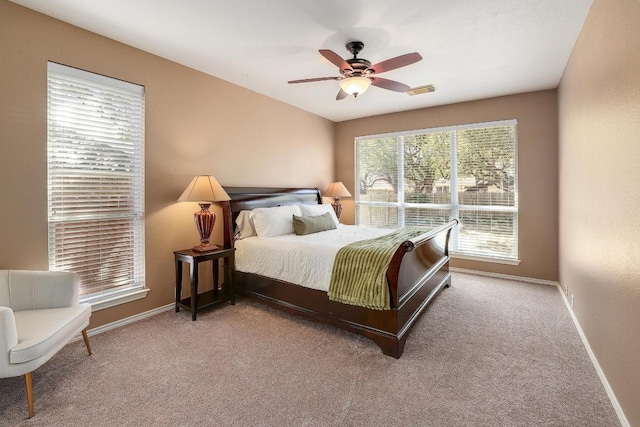 bedroom featuring ceiling fan, carpet floors, and baseboards