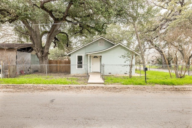 view of front of house with a fenced front yard and stucco siding