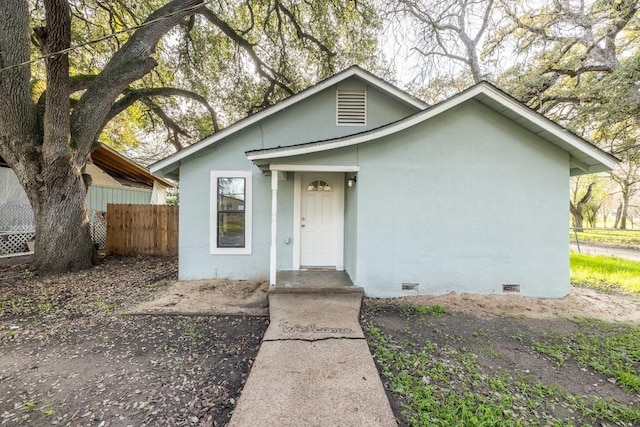 bungalow featuring crawl space and fence