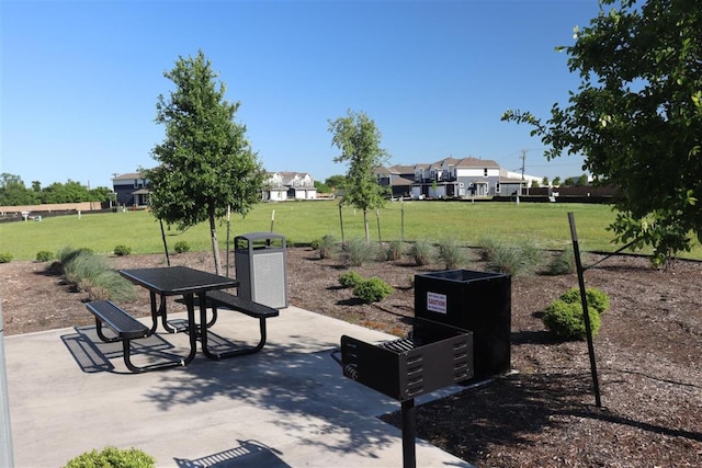 surrounding community featuring a patio area and a yard