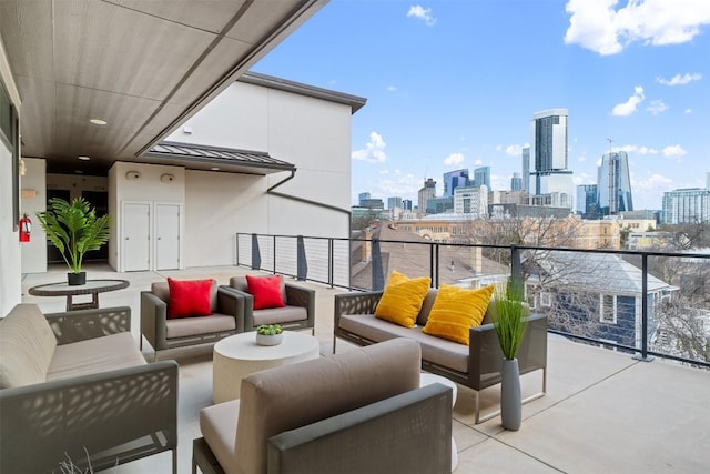 balcony with a view of city and outdoor lounge area