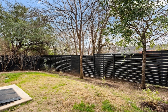 view of yard with a fenced backyard