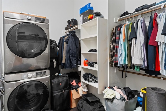 laundry room with laundry area and stacked washing maching and dryer