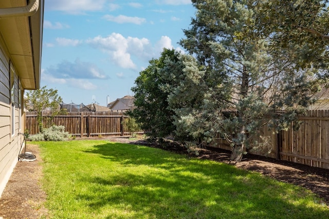 view of yard featuring a fenced backyard