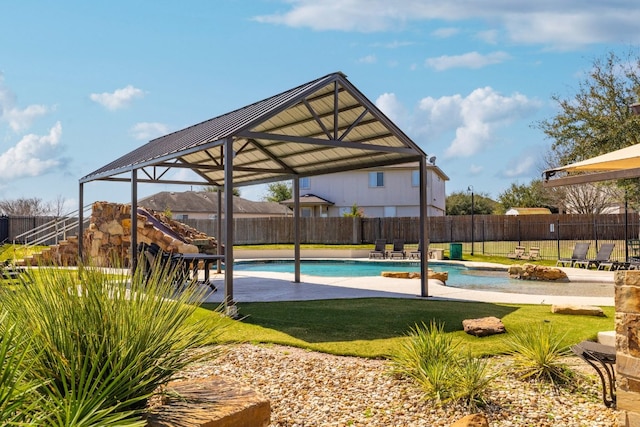 view of swimming pool featuring a fenced in pool, a yard, fence, and a patio