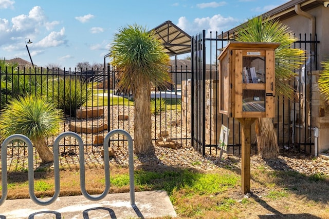 view of gate featuring fence