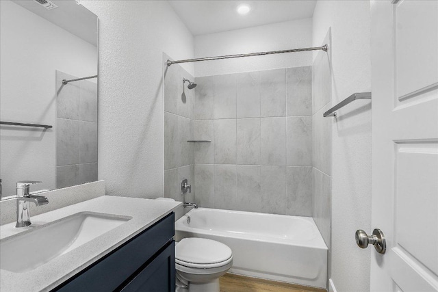 842 Nadal Path, Round Rock, TX 78664 - bathroom featuring vanity,  shower combination, toilet, and wood finished floors