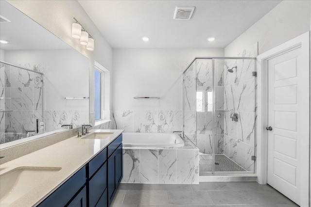 842 Nadal Path, Round Rock, TX 78664 - bathroom featuring a bath, double vanity, a marble finish shower, and recessed lighting