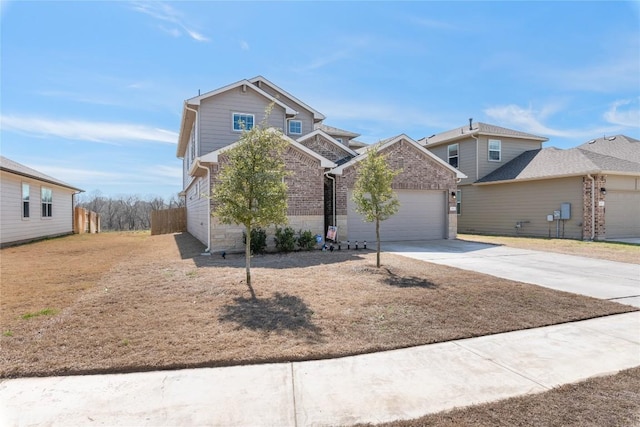 traditional home with stone siding, concrete driveway, brick siding, and an attached garage