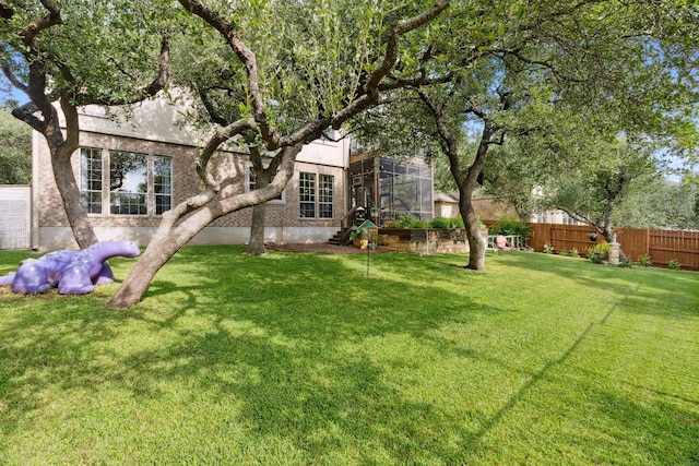 view of yard featuring fence