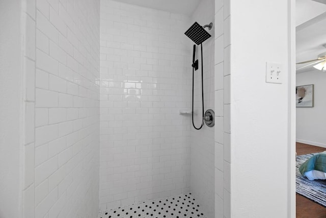 bathroom with tiled shower