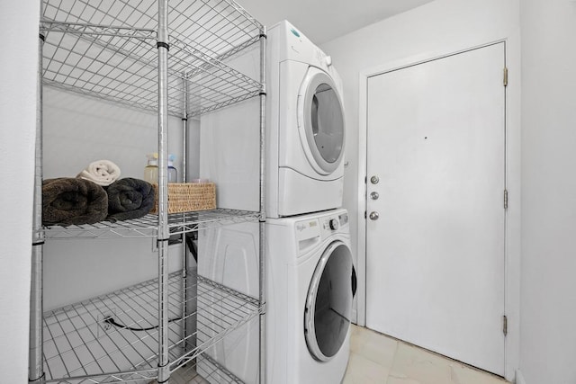 washroom with laundry area and stacked washing maching and dryer