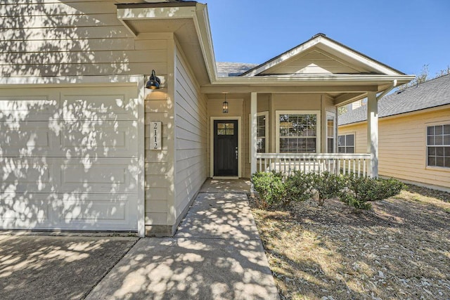 exterior space with an attached garage and covered porch