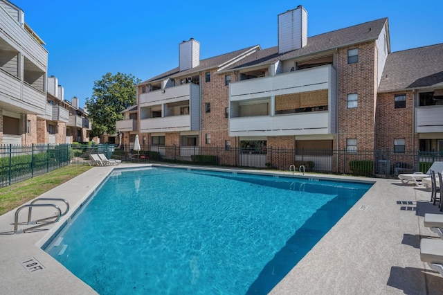 community pool with fence