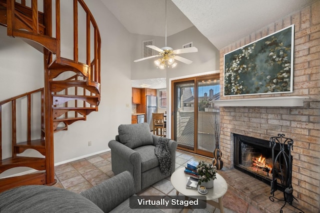 living room with visible vents, a brick fireplace, ceiling fan, baseboards, and stairs