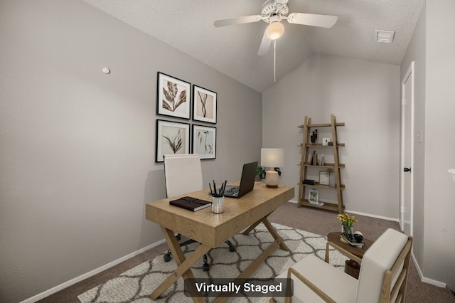 home office with baseboards, visible vents, ceiling fan, vaulted ceiling, and carpet flooring