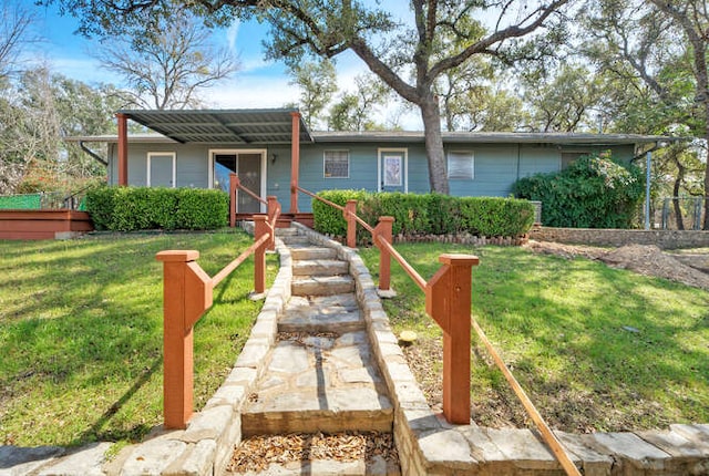 single story home featuring a front yard