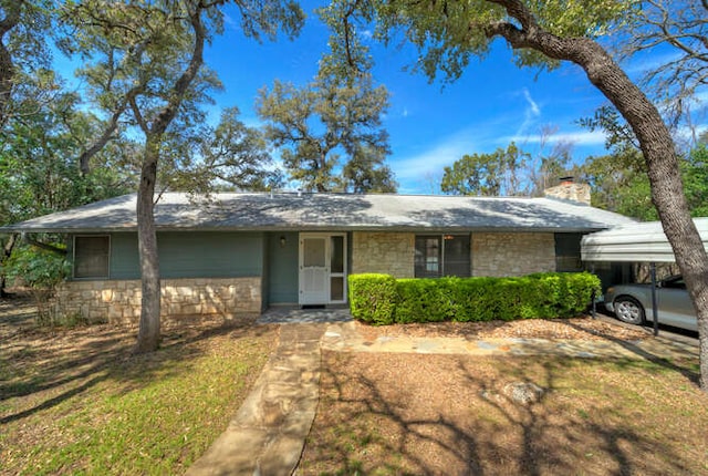 5600 Lakeview Dr, Austin, TX 78734 - single story home featuring stone siding and a chimney