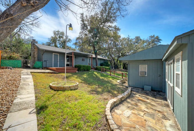 5600 Lakeview Dr, Austin, TX 78734 - view of yard featuring a patio area, a jacuzzi, and fence
