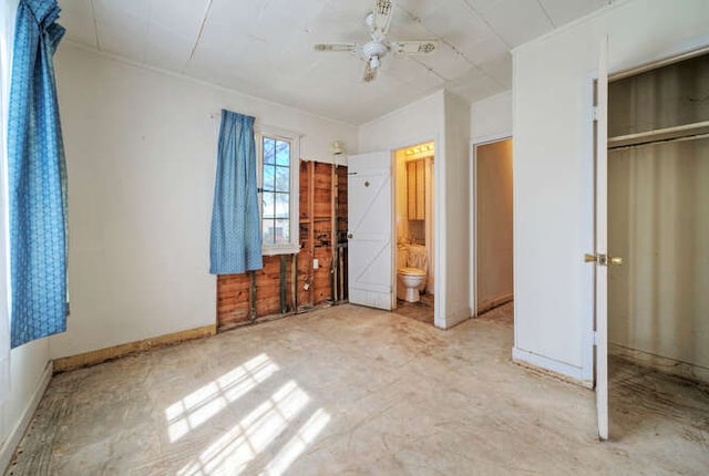 unfurnished bedroom with ceiling fan, a closet, and baseboards