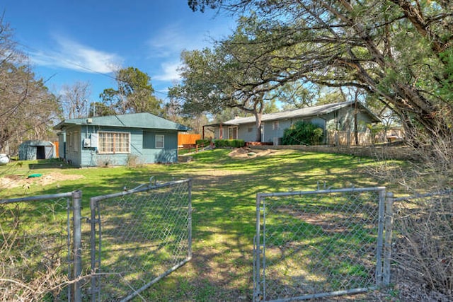 view of yard with fence and a gate