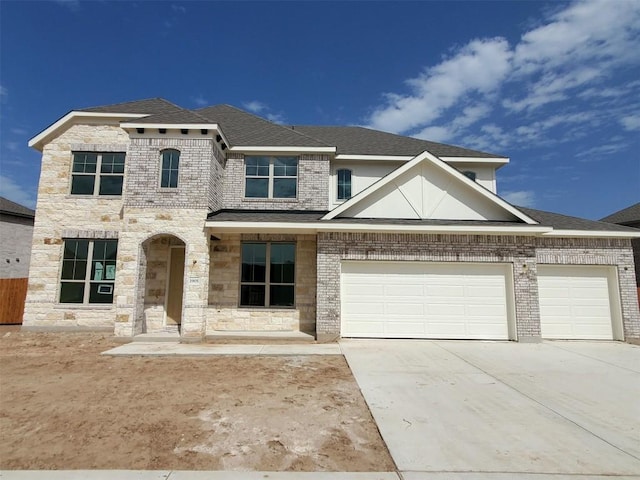 view of front of property featuring concrete driveway, brick siding, roof with shingles, and an attached garage