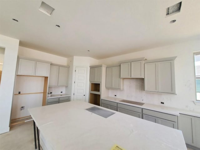 kitchen featuring gray cabinets and a kitchen island