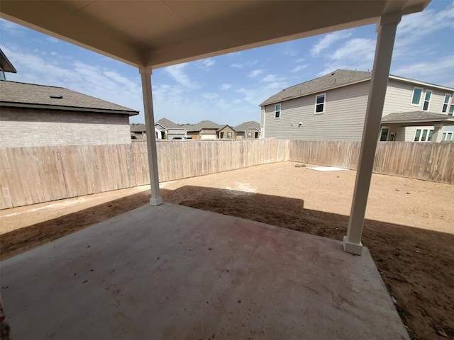 view of patio / terrace with a residential view and a fenced backyard