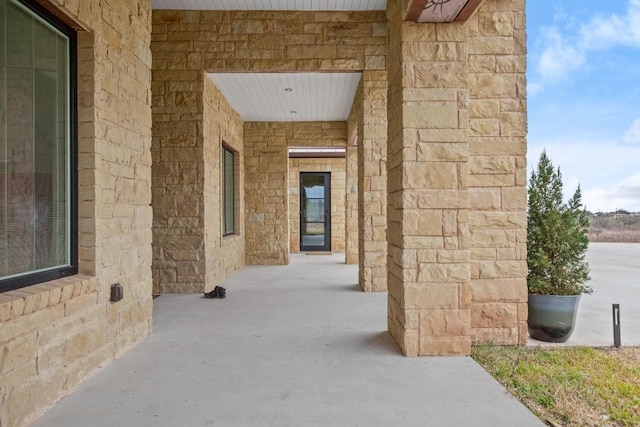 entrance to property with stone siding