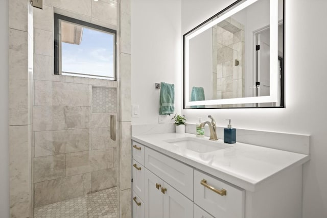 full bathroom featuring a shower stall and vanity