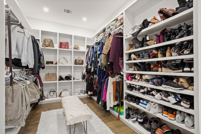 walk in closet featuring wood finished floors and visible vents