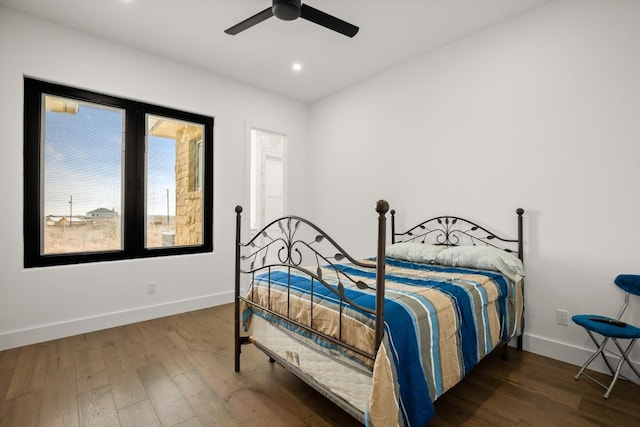 bedroom featuring hardwood / wood-style floors, recessed lighting, and baseboards