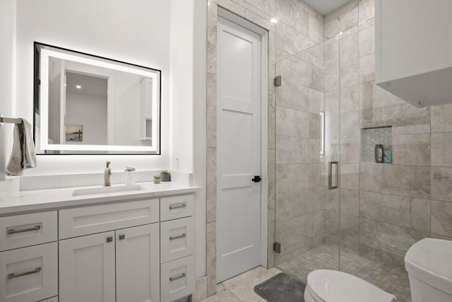 full bath with toilet, a shower stall, and vanity