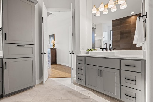 full bathroom featuring vanity, baseboards, and tile patterned floors