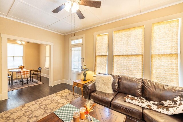 626 Saint Vincent St, Gonzales, TX 78629 - living area with healthy amount of natural light, ceiling fan, dark wood-style floors, baseboards, and ornamental molding
