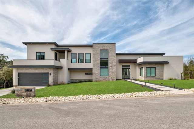 modern home featuring stone siding, a front yard, and stucco siding