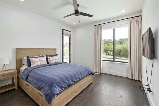 bedroom with dark wood-type flooring, recessed lighting, and baseboards