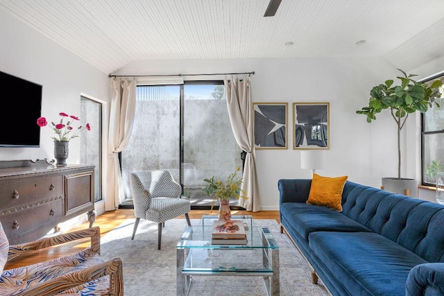 living area featuring lofted ceiling, wood ceiling, and wood finished floors