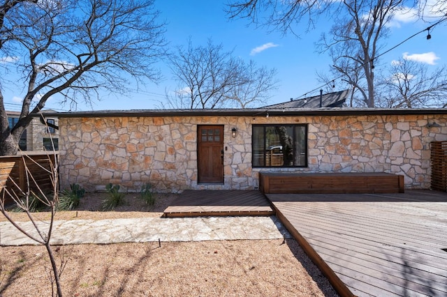 view of front of home with a wooden deck