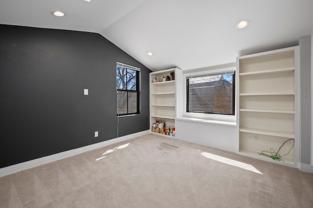 unfurnished bedroom featuring carpet flooring, recessed lighting, baseboards, and vaulted ceiling