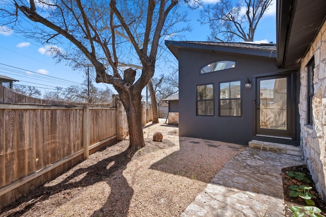 exterior space featuring a fenced backyard