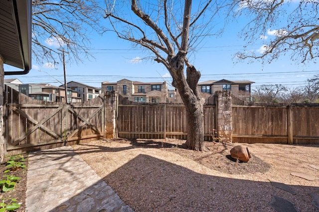 view of yard with a gate and fence