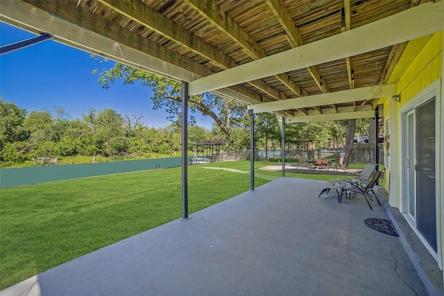 view of patio featuring fence