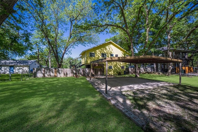 view of home's community featuring a yard and fence