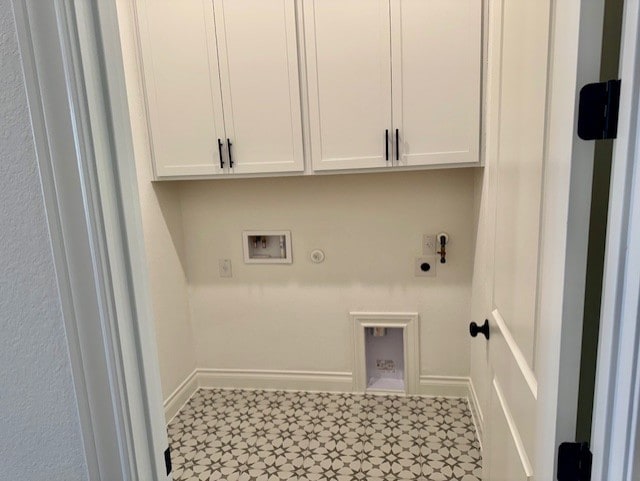 washroom featuring cabinet space, washer hookup, gas dryer hookup, electric dryer hookup, and baseboards